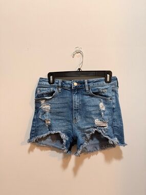 High-Rise Distressed Denim Shorts in Blue